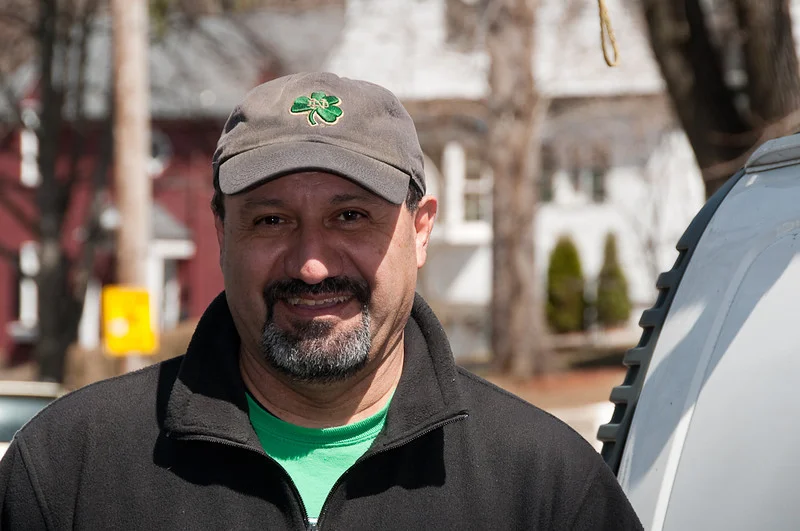 Vincent Cueva, President of McLeod Brothers, standing outside a job site